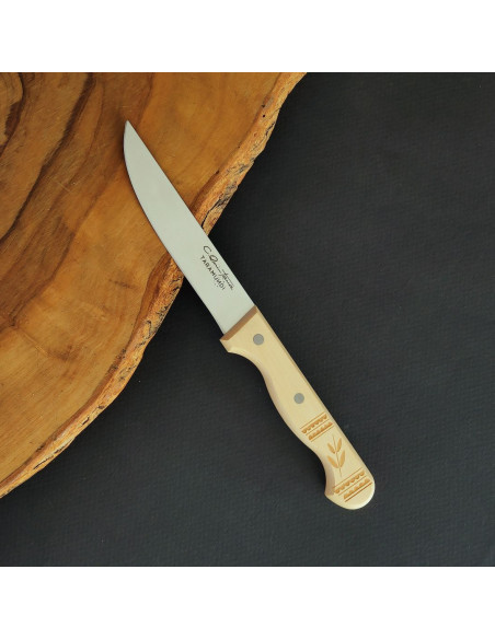 Cuchillo mesa punta vuelta con empuñadura en madera de boj decorada del artesano Carlos Quintana.